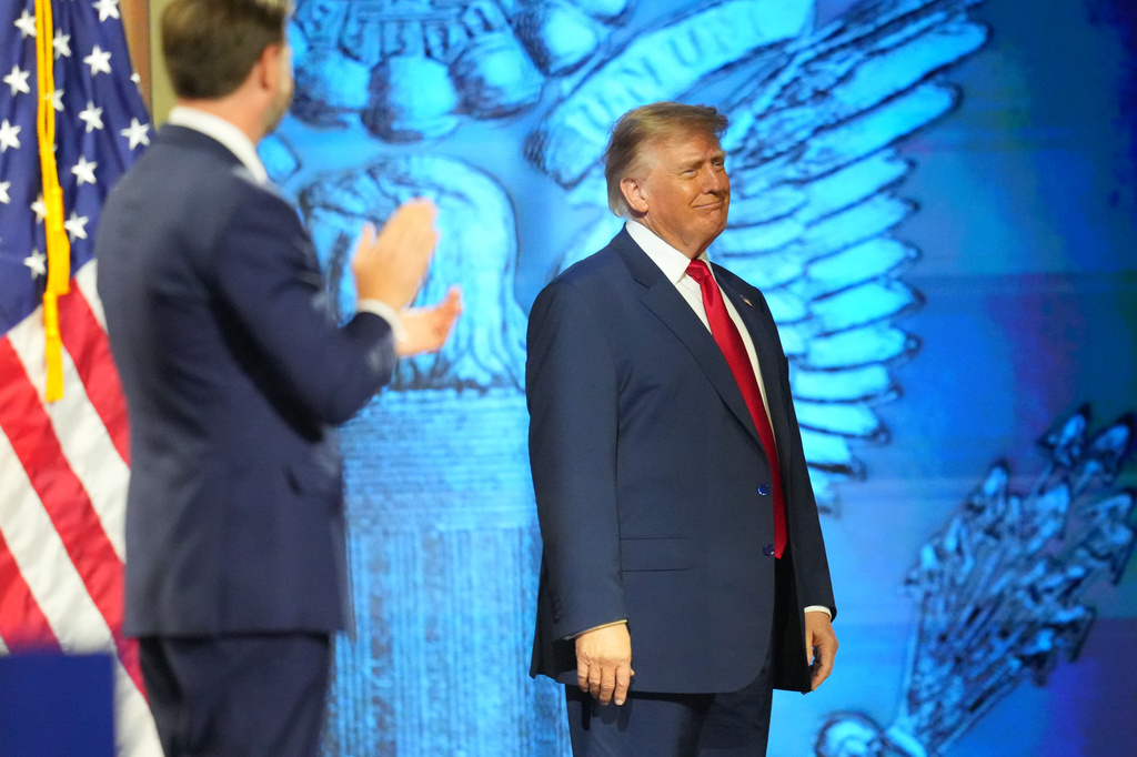 Vice President JD Vance applauds as President Donald Trump arrives on the stage at the Republican convention Thursday, Sept. 10, 2026, in Dallas. (AP Photo/Julio Cortez)