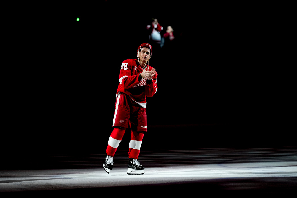 Detroit Red Wings right wing Patrick Kane celebrates after the team's win against the Vancouver Canucks in an NHL hockey game after scoring his 500th career goal Thursday, Jan. 8, 2026, in Detroit. (AP Photo/Ryan Sun)