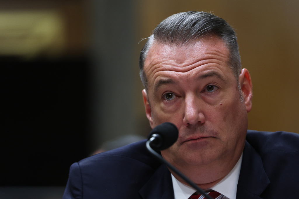 FILE - Todd Lyons, senior official performing the duties of the director at U.S. Immigration and Customs Enforcement, listens during a Senate Homeland Committee hearing on Capitol Hill in Washington, Feb. 12, 2026. (AP Photo/Tom Brenner, File)