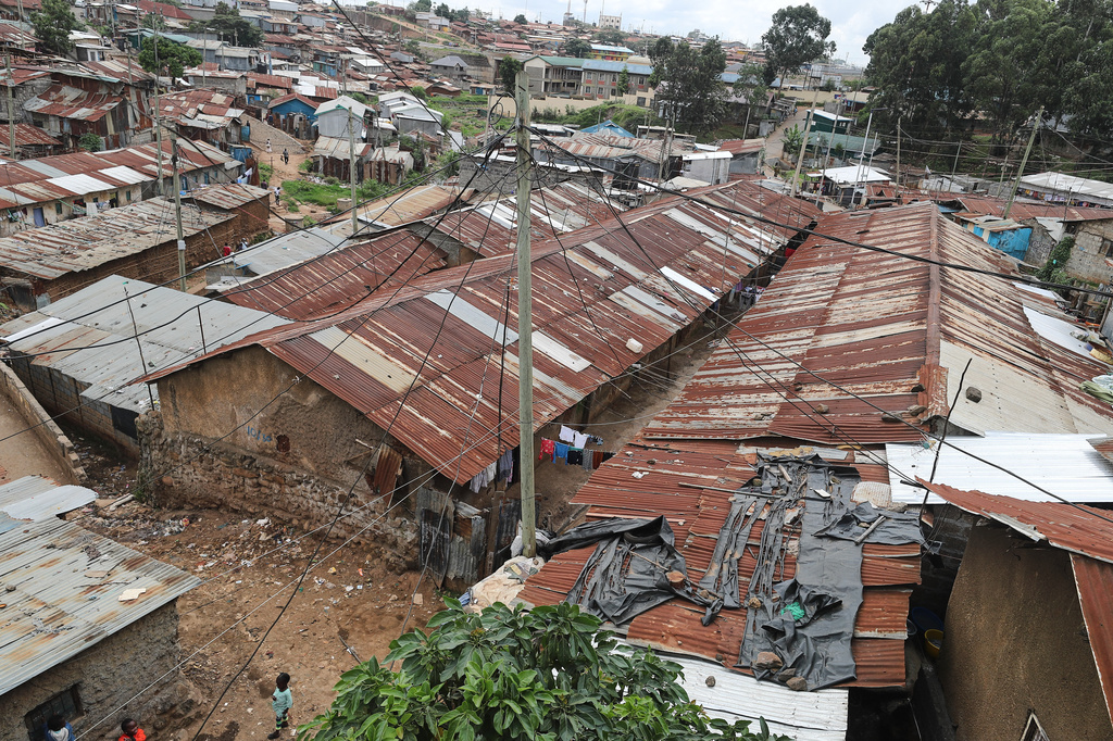 A view of electric wire poles and cables towering over the Kibera informal settlement in Nairobi, Kenya, Tuesday, March 31, 2026. (AP Photo/Henry Naminde)