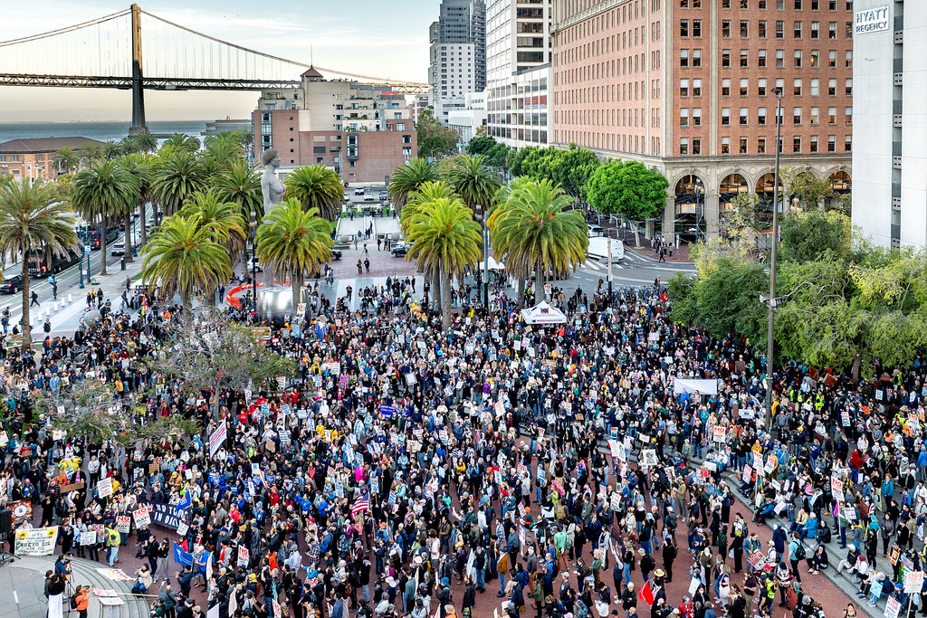 People protest against immigration raids in San Francisco on Thursday, Oct. 23, 2025. (AP Photo/Noah Berger)