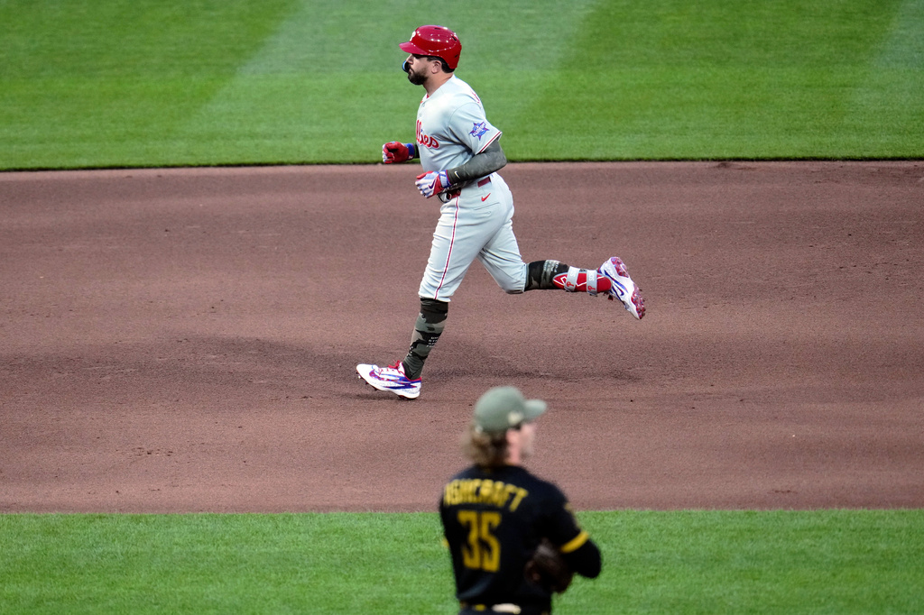 Philadelphia Phillies' Kyle Schwarber, top, rounds the bases after hitting a two-run home run off Pittsburgh Pirates pitcher Braxton Ashcraft during the fifth inning of a baseball game in Pittsburgh, Friday, May 15, 2026. (AP Photo/Gene J. Puskar)