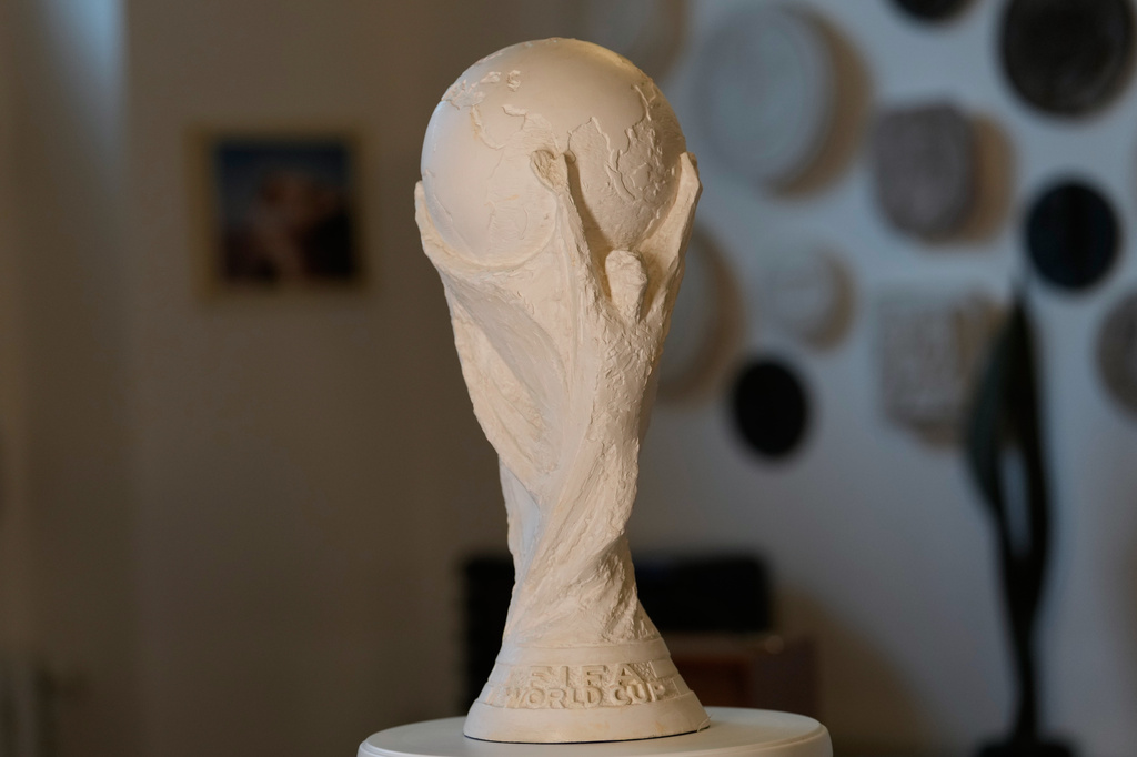 The original plaster World Cup trophy sculpture is displayed at the late sculptor Silvio Gazzaniga's warehouse in Pioltello, Italy, Saturday, July 11, 2026. (AP Photo/Luca Bruno)