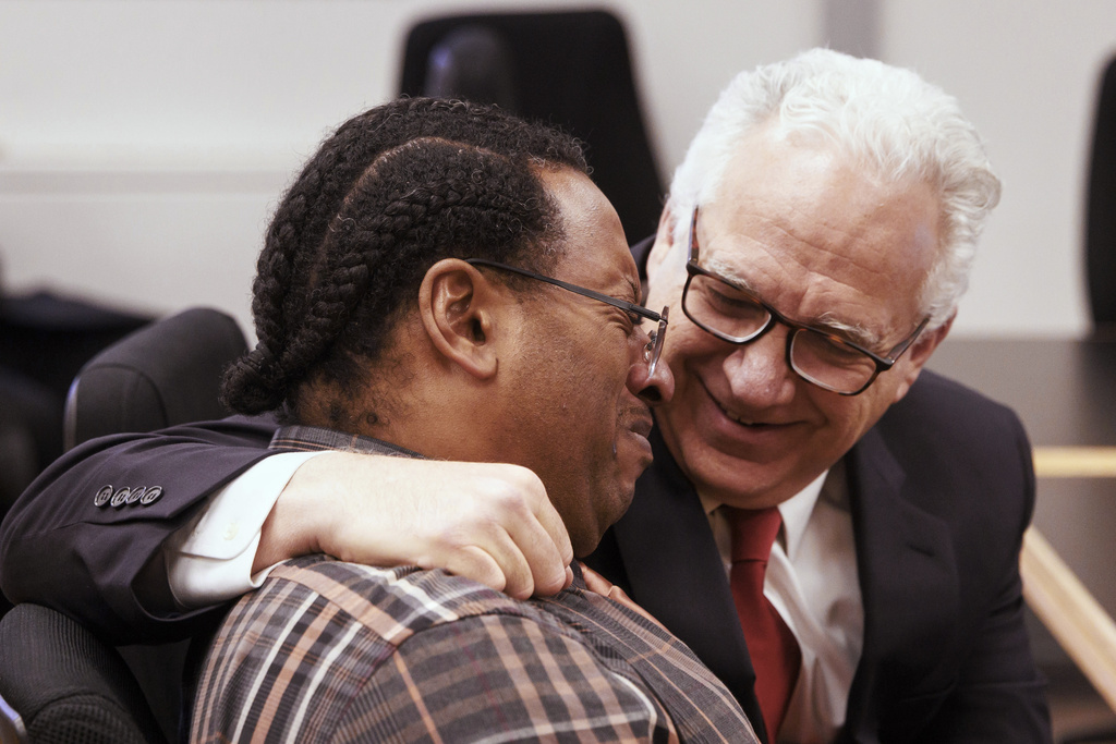 Antonio Mays Sr., left, and his attorney Evan Oshan react as the verdict is read at the King County Courthouse, Thursday, Jan. 29, 2026, in Seattle, Wash. (Erika Schultz/The Seattle Times via AP)