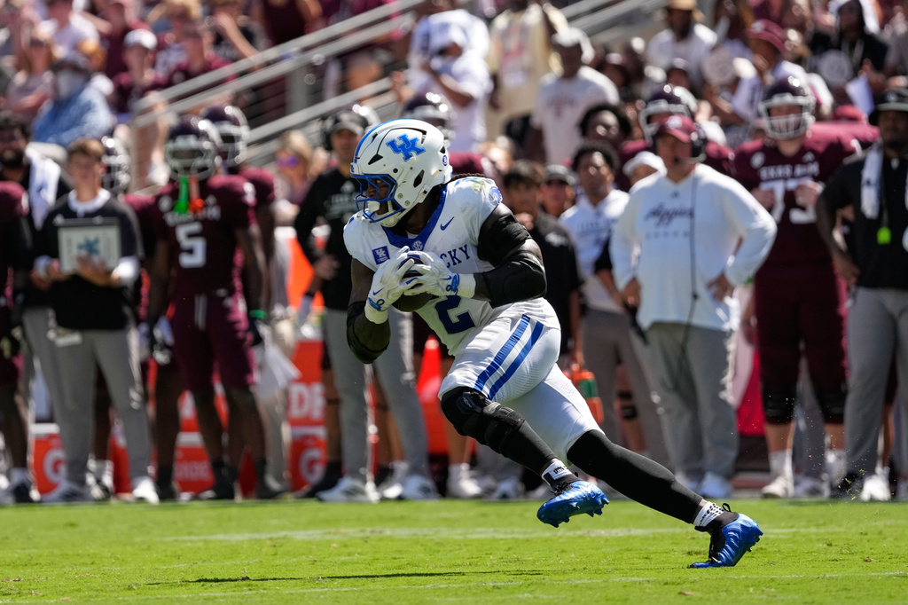 Kentucky's Sam Greene (2) returns an interception against Texas A&M during the first half of an NCAA college football game Saturday, Sept. 19, 2026, in College Station, Texas. (AP Photo/David J. Phillip)