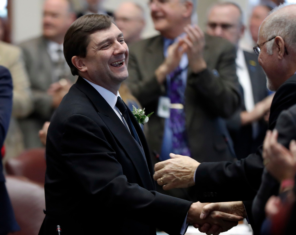 FILE - Senate President Troy Jackson, D-Allagash, is greeted by lawmakers as he arrives for joint session in the House Chamber, Wednesday, Dec., 5, 2018, at the State House in Augusta, Maine. (AP Photo/Robert F. Bukaty,File)