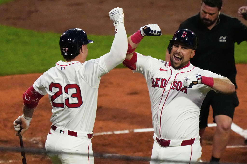 Boston Red Sox Nathaniel Lowe, right, celebrates his third inning home run with Romy Gonzalez in the third inning of a baseball game against Cleveland Guardians, Tuesday, Sept. 2, 2025, in Boston. (AP Photo/Robert F. Bukaty)