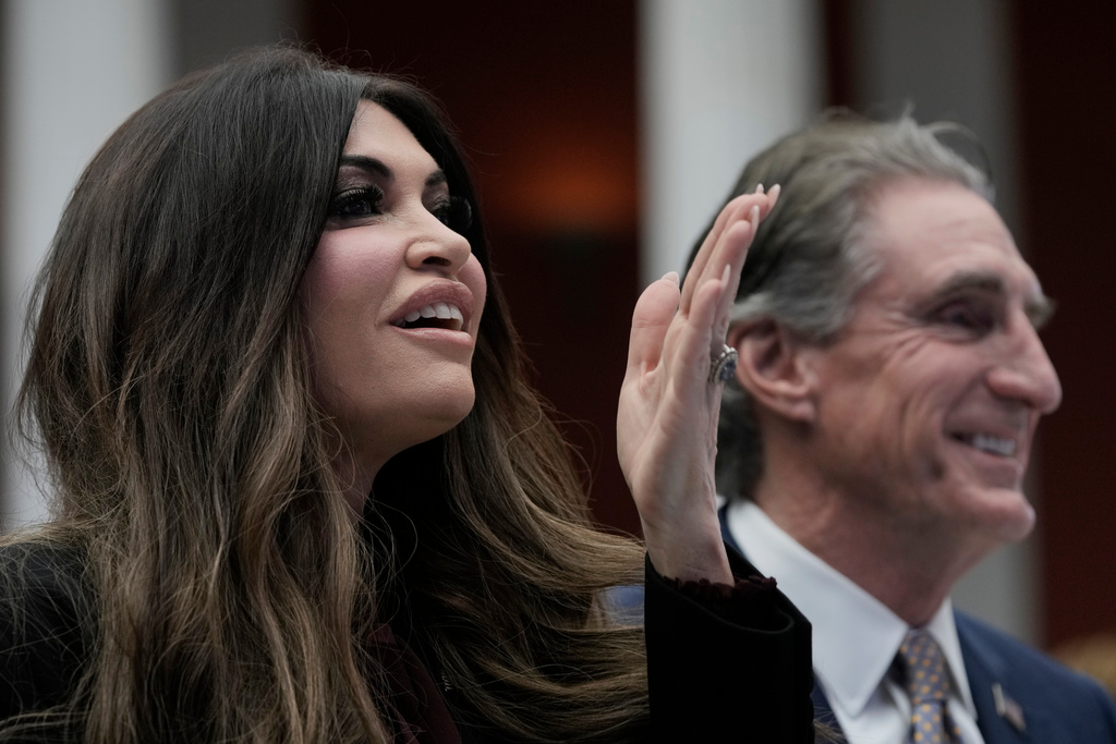 U.S. Interior Secretary Doug Burgum, Secretary, right, and U.S. Ambassador to Greece Kimberly Guilfoyle attend the Atlantic Council conference in Athens, Greece, Thursday, Nov. 6, 2025. (AP Photo/Thanassis Stavrakis)