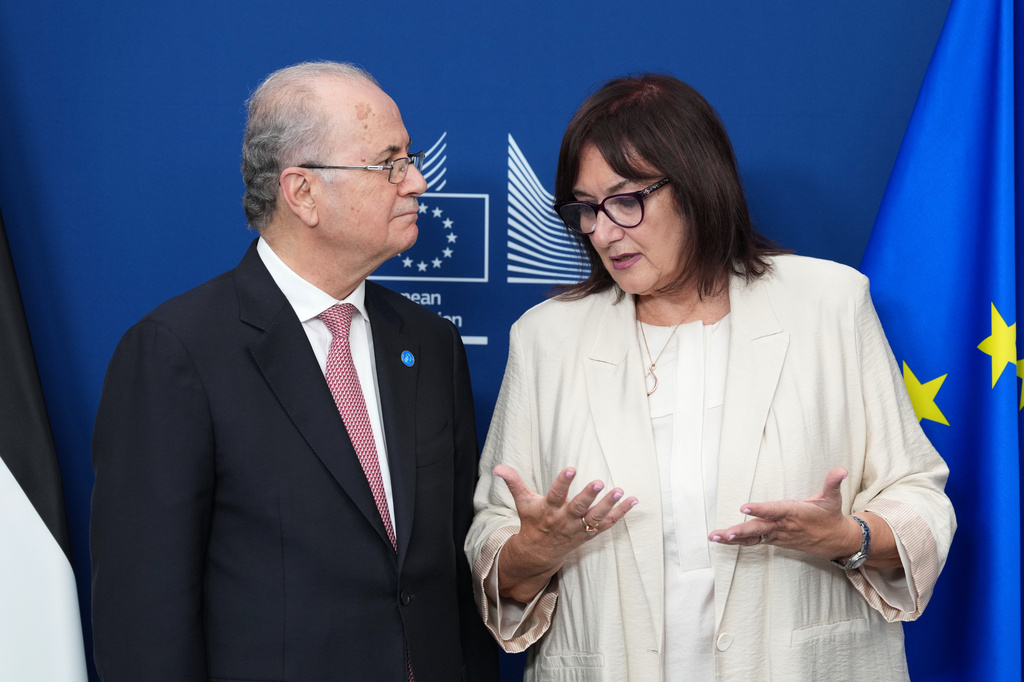 European Commissioner for the Mediterranean Dubravka Suica, right, speaks with Palestinian Prime Minister Mohammad Mustafa after participating in a signature ceremony during a Palestinian Donors Group meeting at EU headquarters in Brussels, Monday, July 13, 2026. (AP Photo/Marius Burgelman)