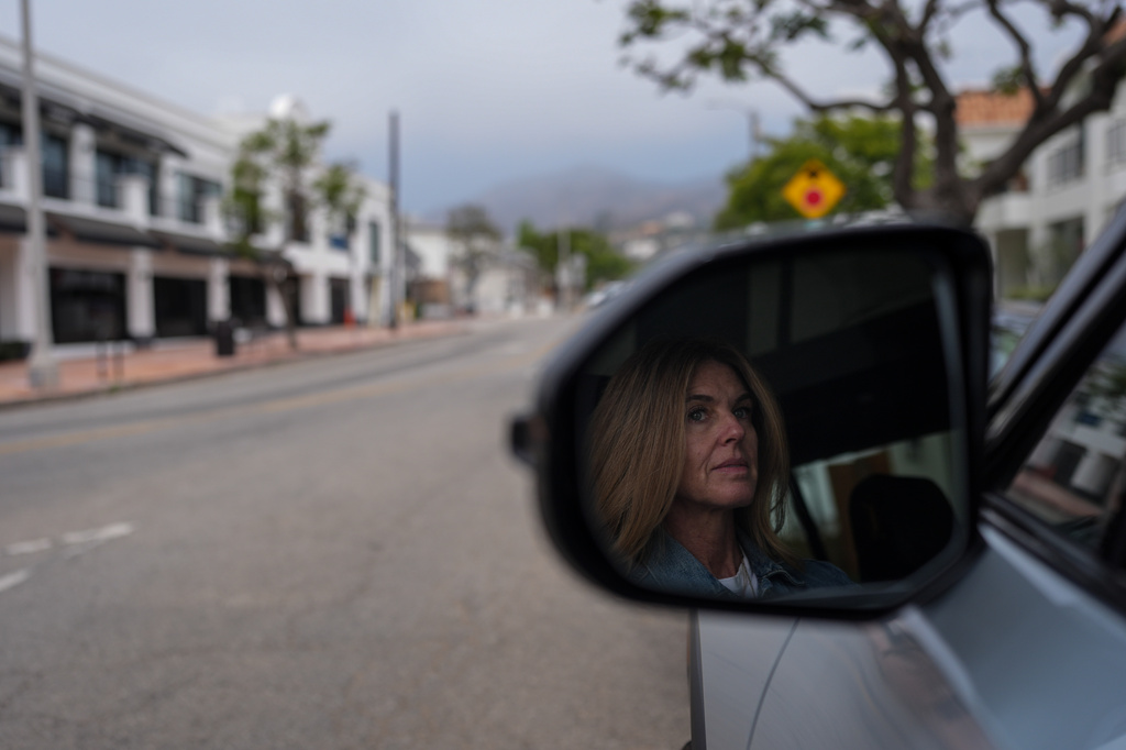 Meghan Wald poses for a photo in her car in the Pacific Palisades neighborhood of Los Angeles, Thursday, June 4, 2026. (AP Photo/Jae C. Hong)