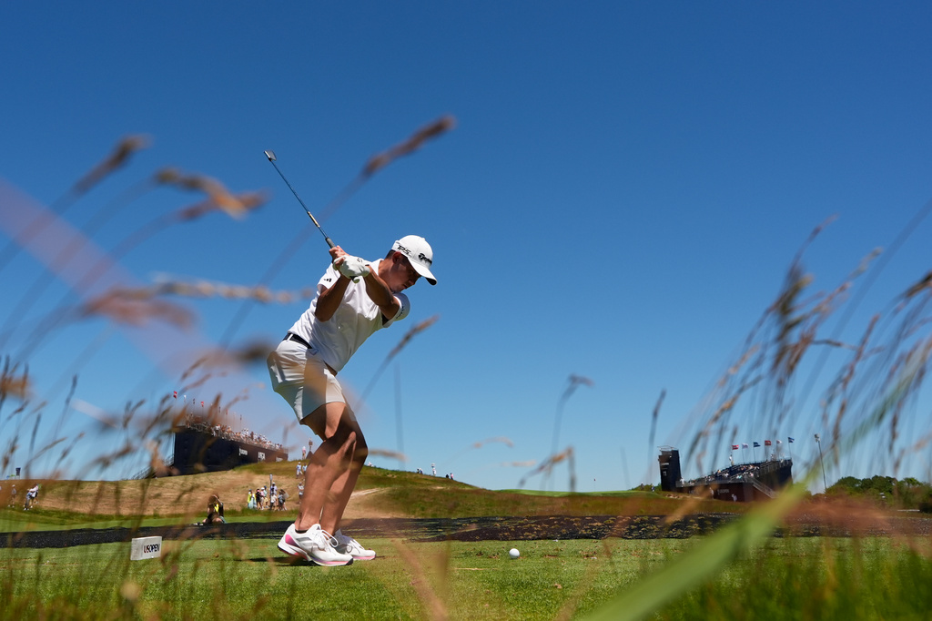 Collin Morikawa hits his tee shot on the 11th hole during a practice round for the U.S. Open golf tournament at Shinnecock Hills Golf Club in Southampton, N.Y., Monday, June 15, 2026.(AP Photo/David J. Phillip)
