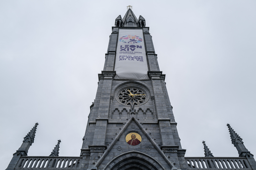 A banners announces the upcoming visit of Pope Leo XIV in Lourdes, southwestern France, Tuesday Sept. 8, 2026 as part of his official visit to France from Sept. 26 to 28. (AP Photo/Fred Scheiber)