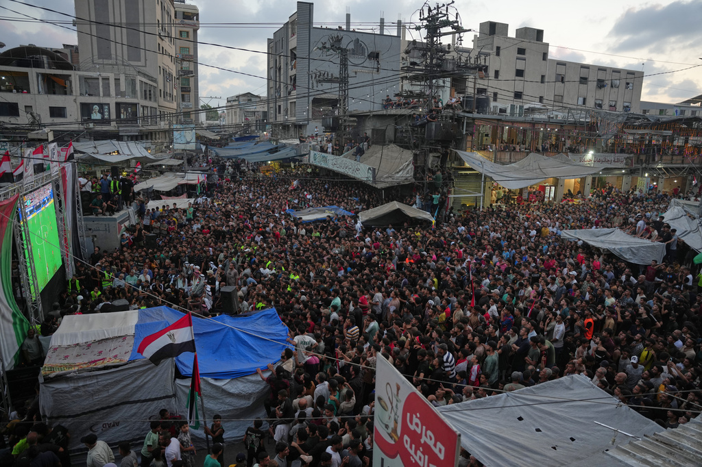 Palestinians watch a live broadcast of the World Cup round of 16 soccer match between Argentina and Egypt in Nuseirat, central Gaza Strip, Tuesday, July 7, 2026. (AP Photo/Abdel Kareem Hana)
