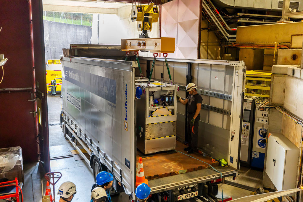 Technicians load the transportable antimatter trap into a truck from the Antimatter Factory at the European Organization for Nuclear Research (CERN) for a road test in Meyrin near Geneva, Switzerland, Tuesday, March 24, 2026. (Salvatore Di Nolfi/Keystone via AP)