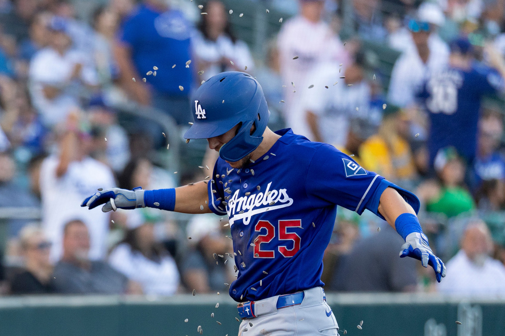 Los Angeles Dodgers' Tommy Edman celebrates after hitting a three-run home run during the third inning of a baseball game against the Athletics Tuesday, June 30, 2026, in West Sacramento, Calif. (AP Photo/Sara Nevis)
