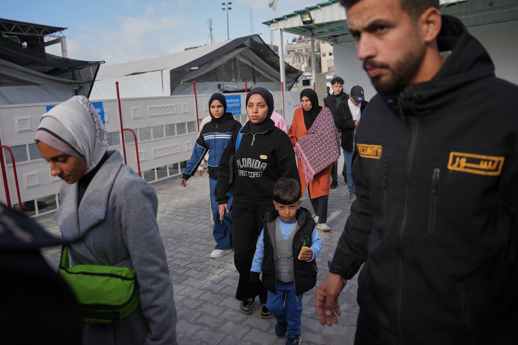 Palestinians patients and their relatives gather to board a bus in Khan Younis before they head to the Rafah crossing, leaving the Gaza Strip for medical treatment abroad, Wednesday, Feb. 4, 2026. (AP Photo/Abdel Kareem Hana)