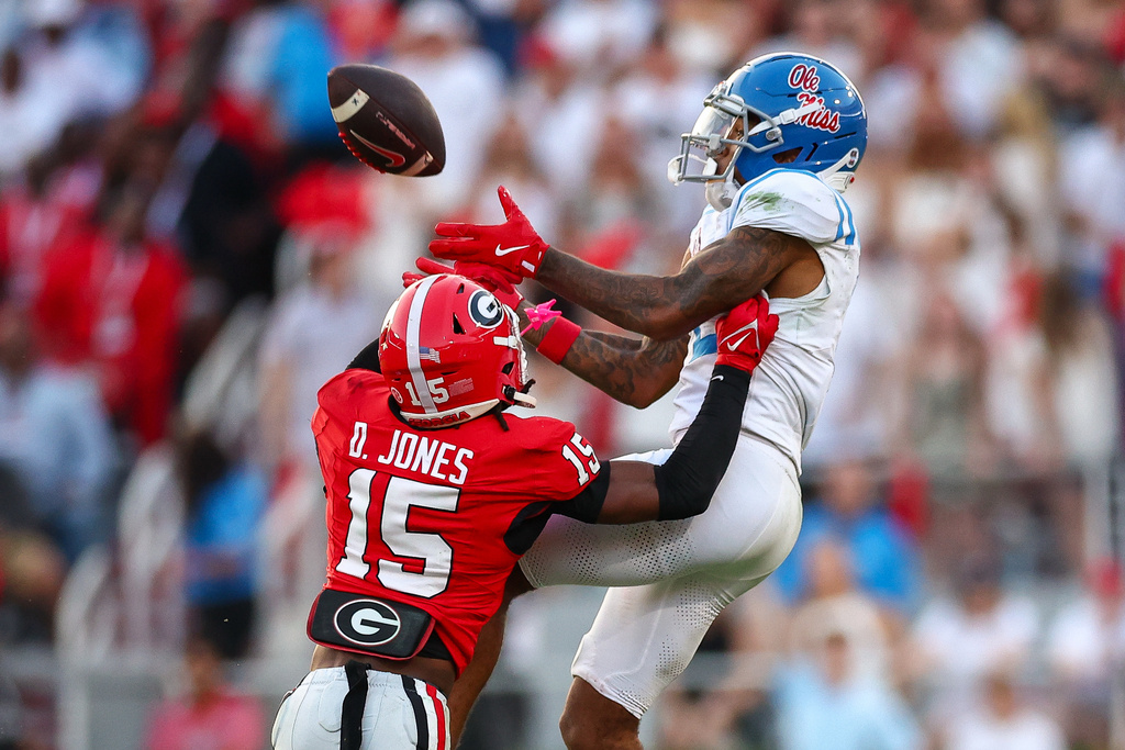 Georgia defensive back Demello Jones (15) defends a pass against Mississippi wide receiver Harrison Wallace III, right, during the second half of an NCAA college football game Saturday, Oct. 18, 2025, in Athens, Ga. (AP Photo/Colin Hubbard)