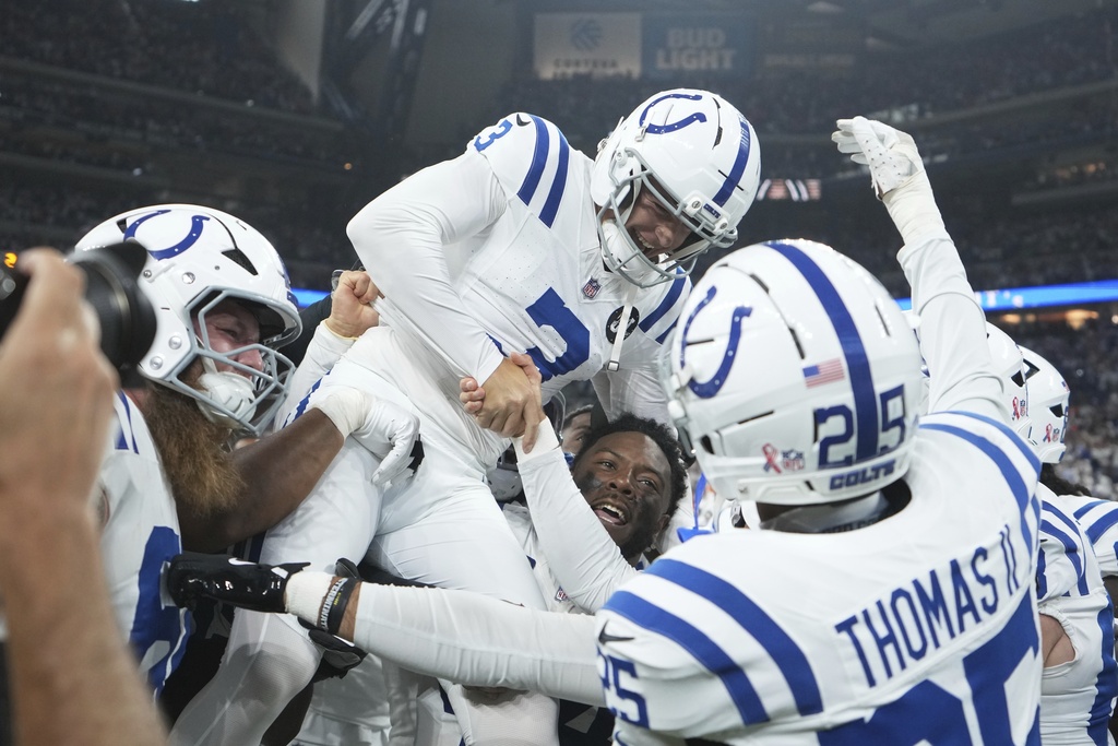 Indianapolis Colts place kicker Spencer Shrader (3) celebrates with teammates after kicking the game winning field goal during the second half an NFL football game against the Denver Broncos, Sunday, Sept. 14, 2025, in Indianapolis. (AP Photo/Michael Conroy)