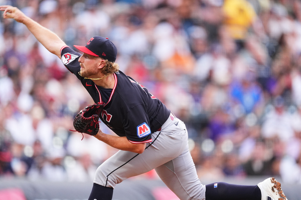 Cleveland Guardians starting pitcher Tanner Bibee works against the Colorado Rockies in the first inning of a baseball game Saturday, Aug. 22, 2026, in Denver. (AP Photo/David Zalubowski)
