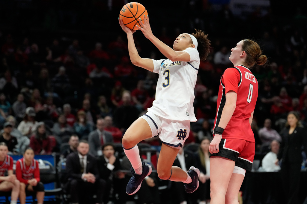 Notre Dame guard Hannah Hidalgo (3) goes to the basket past Fairfield guard Jillian Huerter (0) in the first half in the first round of the NCAA college basketball tournament, Saturday, March 21, 2021, in Columbus, Ohio. (AP Photo/Sue Ogrocki)