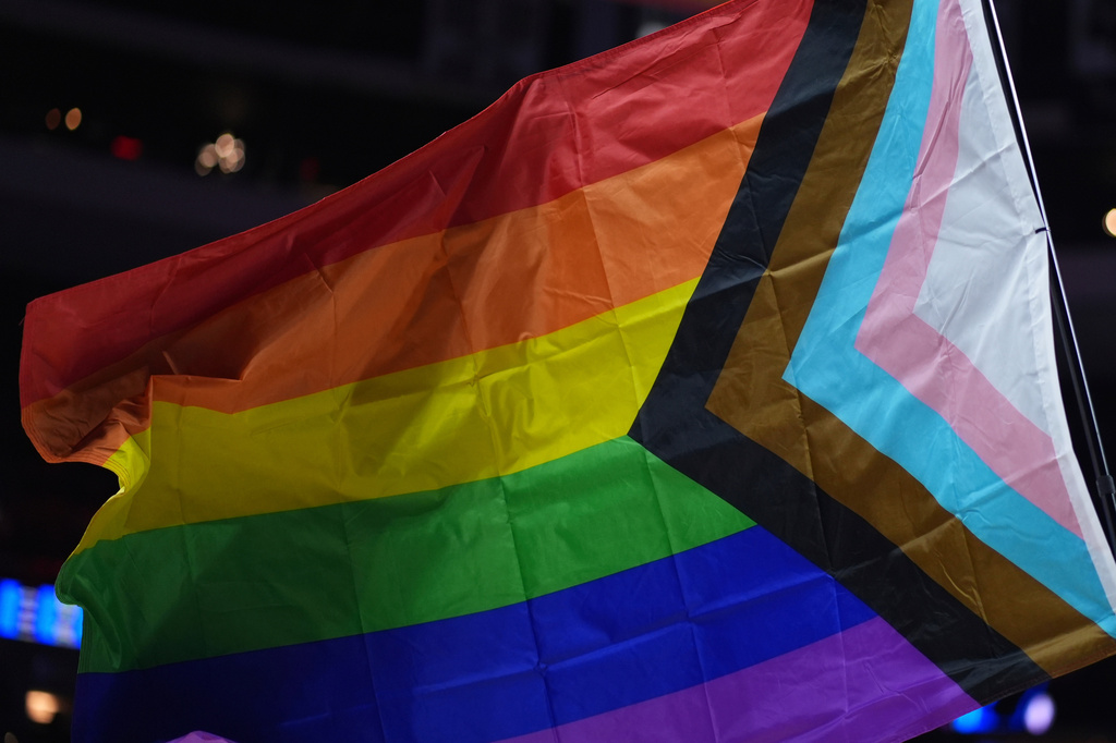 FILE - A pride flag is waved during an NBA basketball game in Philadelphia on Sunday, March 30, 2025. (AP Photo/Matt Slocum, File)