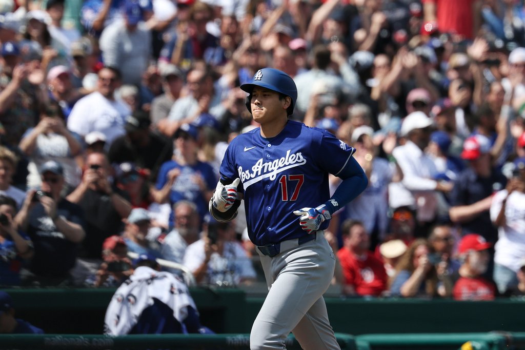 Los Angeles Dodgers' Shohei Ohtani (17) runs the bases after hitting a three-run home run during the third inning of an baseball game against the Washington Nationals, Friday, April 3, 2026, in Washington. (AP Photo/Terrance Williams)