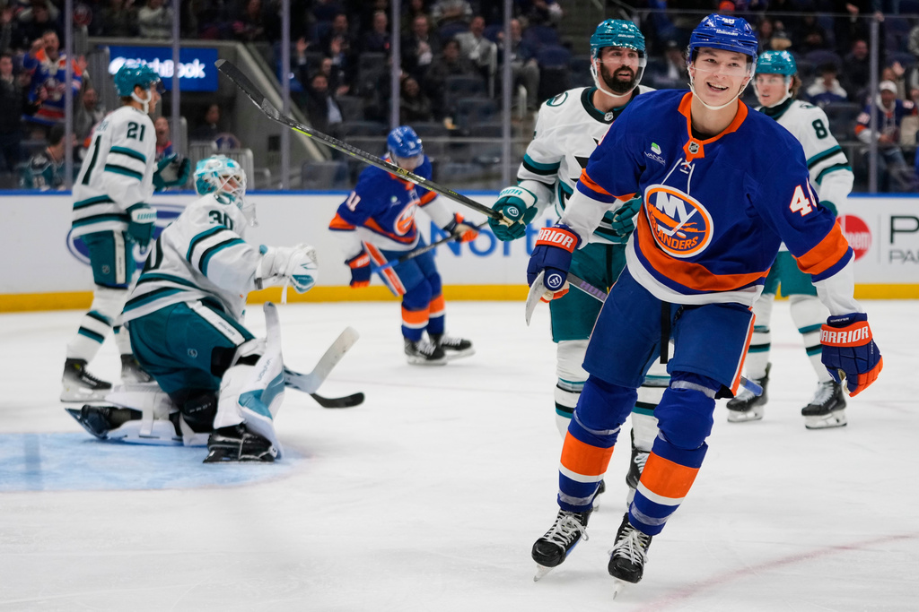 New York Islanders' Matthew Schaefer (48) smiles after scoring a goal during the second period of an NHL hockey game against the San Jose Sharks Tuesday, Oct. 21, 2025, at UBS Arena in Elmont, N.Y. (AP Photo/Frank Franklin II)