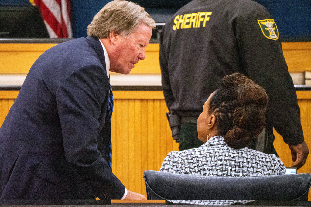 Tiger Woods' defense attorney Doug Duncan and Assistant State Attorney Nirlaine Tallandier Smartt speak during a hearing in Martin County circuit court Tuesday, May 12, 2026, in Stuart, Fla. (Christopher Beckett/New York Post via AP)