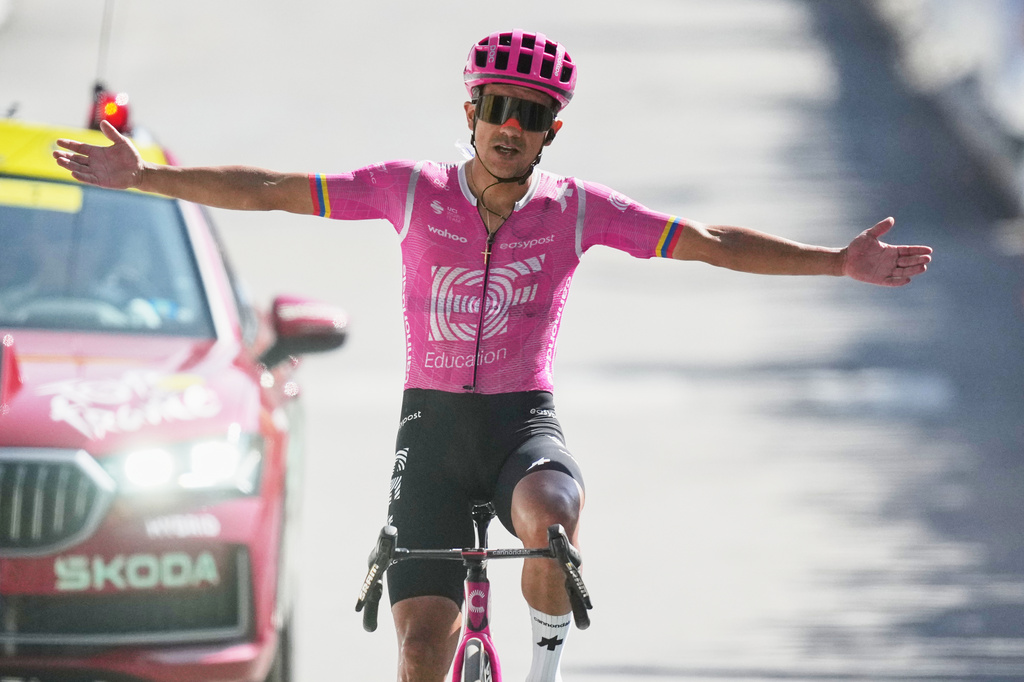 Ecuador's Richard Carapaz celebrates as he crosses the finish line to win the eighteenth stage of the Tour de France cycling race, with start in Voiron and finish in Orcieres-Merlette, France, Thursday, July 23, 2026. (AP Photo/Mosa'ab Elshamy)