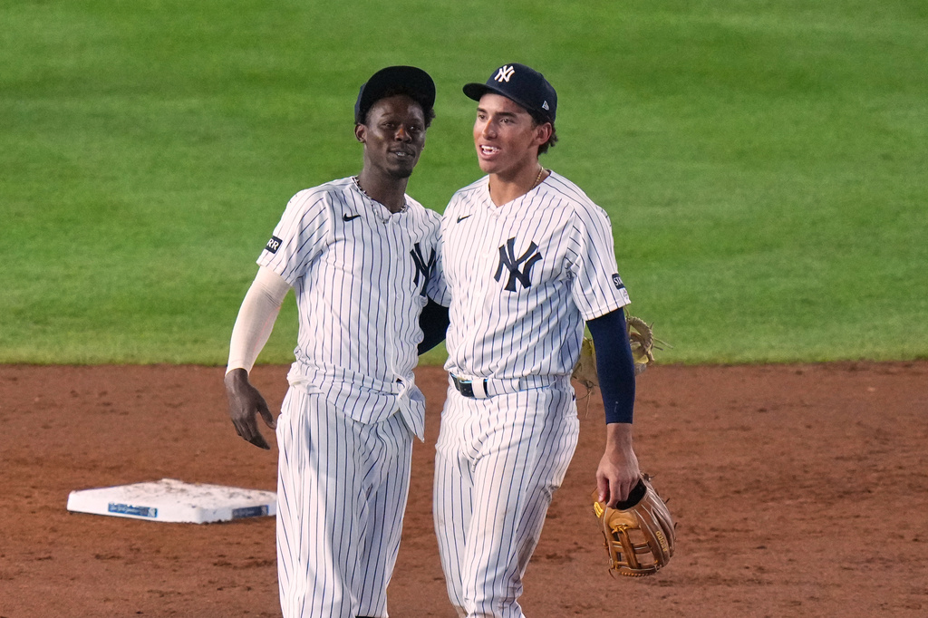 New York Yankees' Jazz Chisholm Jr., left, and George Lombard Jr. smile after a baseball game against the St. Louis Cardinals Tuesday, Aug. 4, 2026, in New York. (AP Photo/Frank Franklin II)