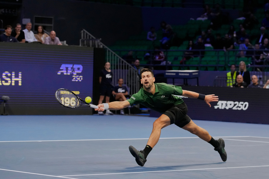 Novak Djokovic of Serbia plays a shot against Alejandro Tabilo of Chile during the ATP tournament round of 16 tennis match, in Athens, Greece, Tuesday, Nov. 4, 2025. (AP Photo/Petros Giannakouris)