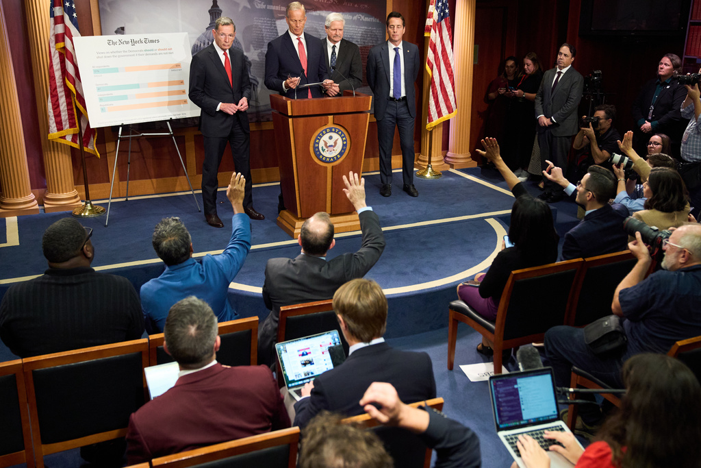 Senate Majority Leader John Thune, R-S.D., center, speaks to reporters about the government shutdown, Tuesday, Sept. 30, 2025, on Capitol Hill in Washington. (AP Photo/Jacquelyn Martin)