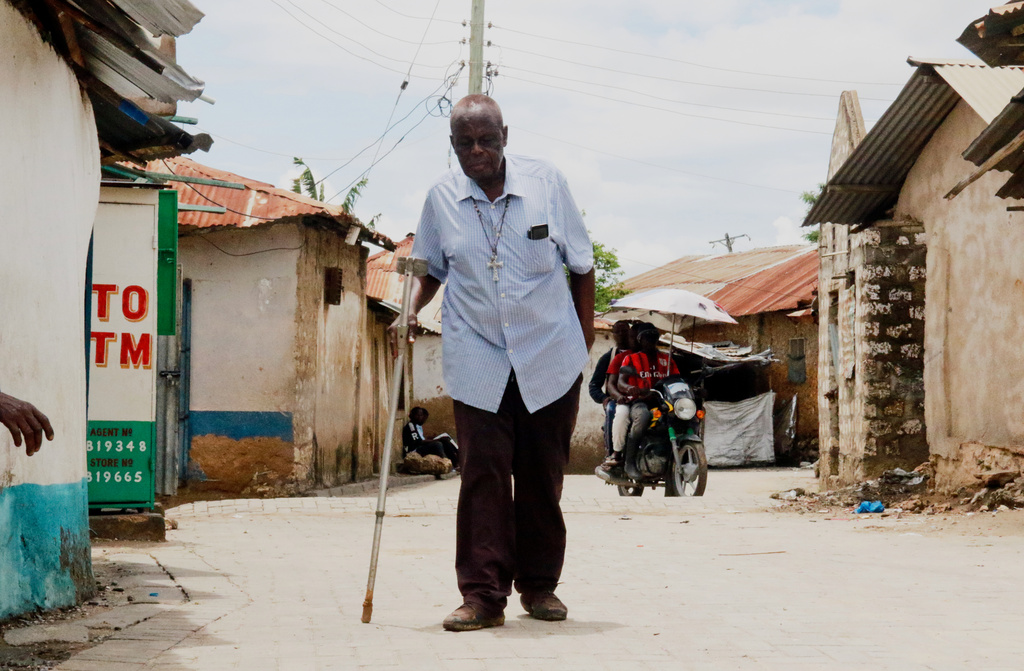 Alfred Ogulo Mulo, a village elder, walks along a street in Mikindani, Mombasa County, Kenya, on April 10, 2026. (AP Photo/Kelvin Rading)