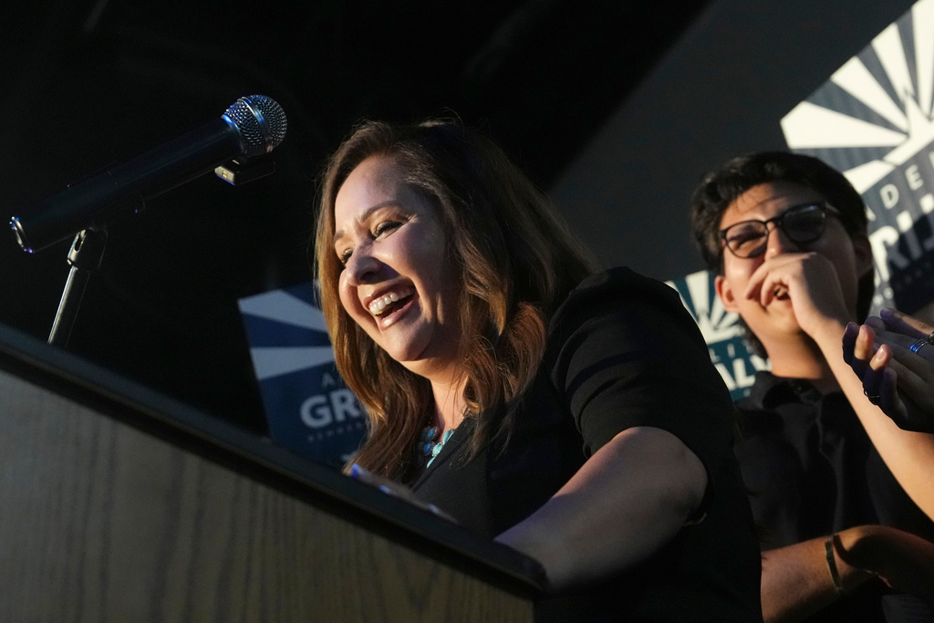 Arizona Democratic candidate Adelita Grijalva, left, smiles as she pauses while speaking to supporters after being declared the winner against Republican Daniel Butierez, to fill the Congressional District 7 seat held by the late U.S. Rep. Raúl Grijalva in a special election Tuesday, Sept. 23, 2025, in Tucson, Ariz. (AP Photo/Ross D. Franklin)