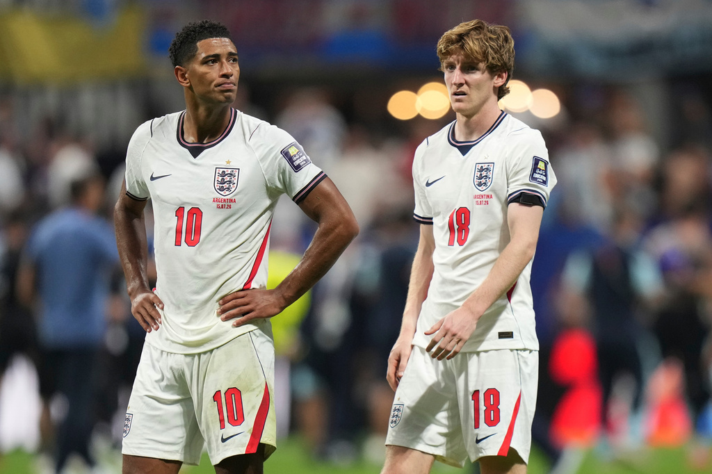 England's Anthony Gordon (18) and England's Jude Bellingham (10) react after the World Cup semifinal soccer match between England and Argentina in Atlanta, Wednesday, July 15, 2026. (AP Photo/Stephanie Scarbrough)