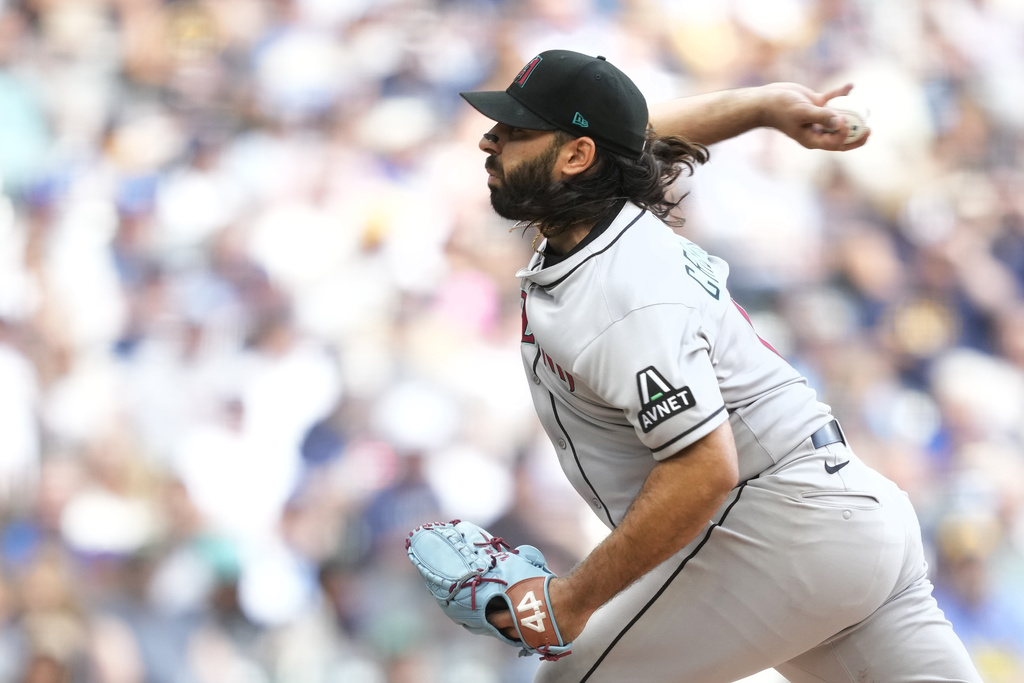 Arizona Diamondbacks pitcher Nabil Crismatt (61) throws during the first inning of a baseball game against the Milwaukee Brewers, Thursday, Aug. 28, 2025, in Milwaukee. (AP Photo/Kayla Wolf)