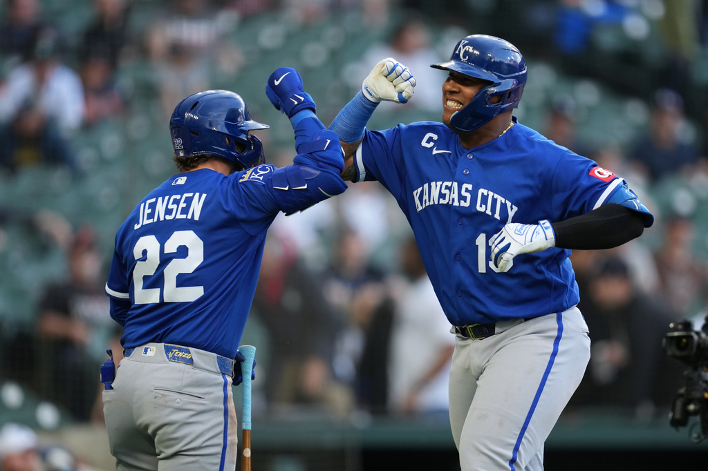 Kansas City Royals catcher Salvador Perez, right, celebrates his three-run home run with Carter Jensen (22) against the Detroit Tigers during the seventh inning of a baseball game Thursday, April 16, 2026, in Detroit. (AP Photo/Paul Sancya)