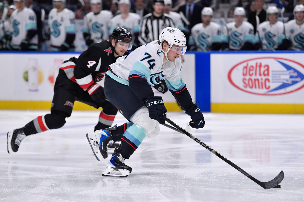 Seattle Kraken center Bobby McMann (74) skates with the puck during the second period of an NHL hockey game against the Buffalo Sabres, Saturday, March 28, 2026, in Buffalo, N.Y. (AP Photo/Adrian Kraus)