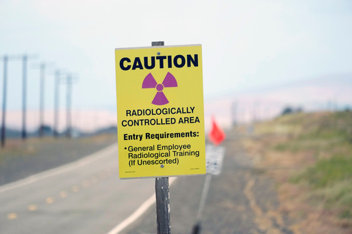 FILE - A caution sign is shown on a road on the Hanford Nuclear Reservation on June 2, 2022, in Richland, Wash. (AP Photo/Ted S. Warren, File) FILE - A caution sign is shown on a road on the Hanford Nuclear Reservation on June 2, 2022, in Richland, Wash. (AP Photo/Ted S. Warren, File)