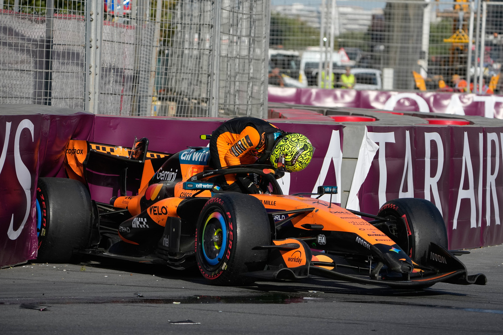 McLaren driver Lando Norris of Britain gets out of his car after a crash during the Azerbaijan F1 Grand Prix auto race, in Baku, Azerbaijan, Saturday, Sept. 26, 2026. (AP Photo/Darko Bandic)