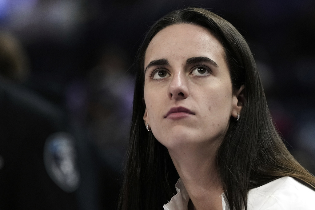 Indiana Fever's Caitlin Clark sits on the bench before a WNBA basketball game against the Golden State Valkyries, Sunday, Aug. 31, 2025, in San Francisco. (AP Photo/Godofredo A. Vásquez)