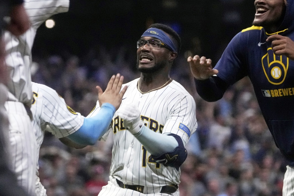 Milwaukee Brewers' Andruw Monasterio celebrates after hitting an RBI walk-off single during the 10th inning of a baseball game against the St. Louis Cardinals Saturday, Sept. 13, 2025, in Milwaukee. (AP Photo/Morry Gash)