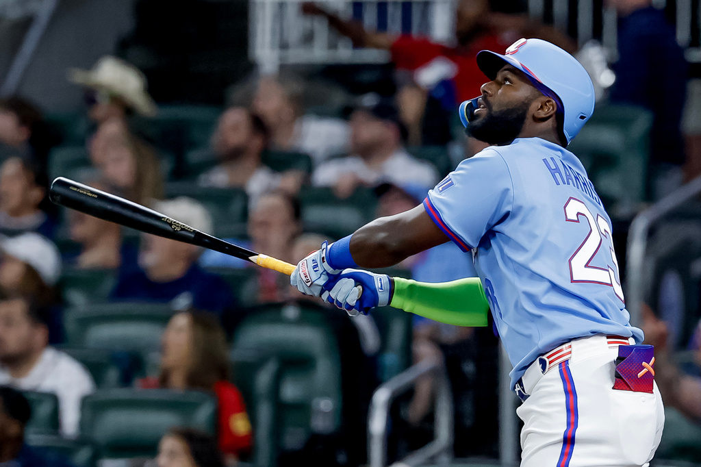 Atlanta Braves designated hitter Michael Harris II watches his RBI sacrifice fly during the fourth inning of a baseball game against the Philadelphia Phillies, Saturday, April 25, 2026, in Atlanta. (AP Photo/Erik S. Lesser)
