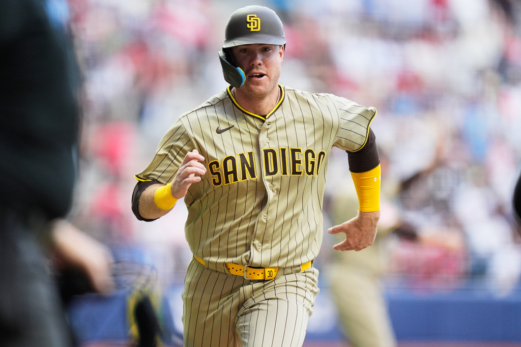 San Diego Padres' Gavin Sheets runs to home plate to score against the Arizona Diamondbacks during the seventh inning of a baseball game in Mexico City, Saturday, April 25, 2026. (AP Photo/Fernando Llano)