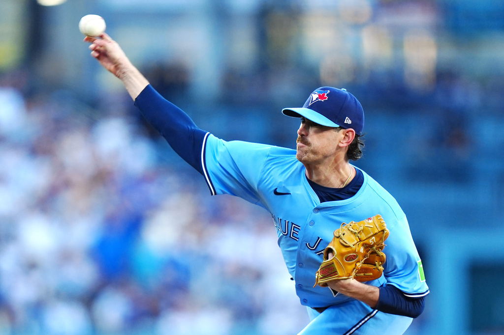 Toronto Blue Jays pitcher Shane Bieber (57) throws against the Los Angeles Dodgers during the first inning in Game 4 of baseball's World Series in Los Angeles, Tuesday, Oct. 28, 2025. (Frank Gunn/The Canadian Press via AP)