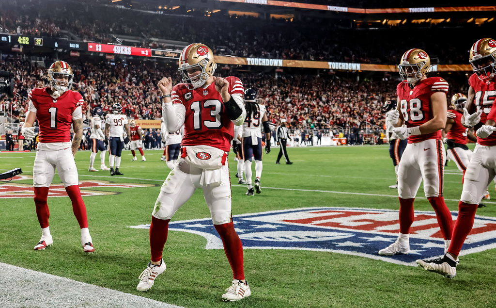 San Francisco 49ers' Brock Purdy (13) dances in the end zone after scoring a touchdown during the first half of an NFL football game against the Chicago Bears in Santa Clara, Calif., Sunday, Dec. 28, 2025. (Carlos Avila Gonzalez/San Francisco Chronicle via AP)