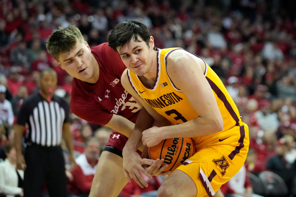 Minnesota forward Bobby Durkin (3) steals the ball from Wisconsin forward Nolan Winter, left, during the first half of an NCAA college basketball game, Wednesday, Jan. 28, 2026, in Madison, Wis. (AP Photo/Kayla Wolf)