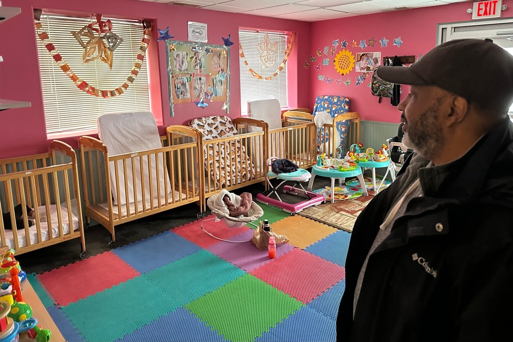 CORRECTS LAST NAME ABC Learning Center director Ahmed Hasan stands in the infant room at his daycare center, in Minneapolis, Minn., on Wednesday, Dec. 31, 2025. (AP Photo/Mark Vancleave)
