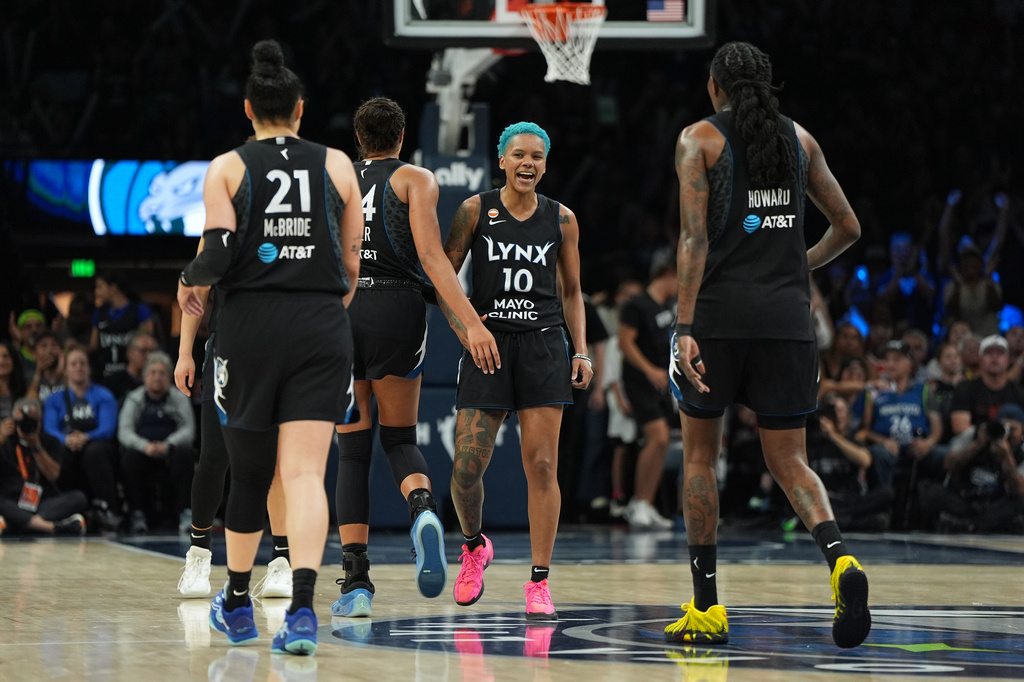 Minnesota Lynx guard Courtney Williams (10) celebrates with teammates after making a basket during the second half of a WNBA basketball game against the Indiana Fever, Sunday, Aug. 2, 2026, in Minneapolis. (AP Photo/Abbie Parr)
