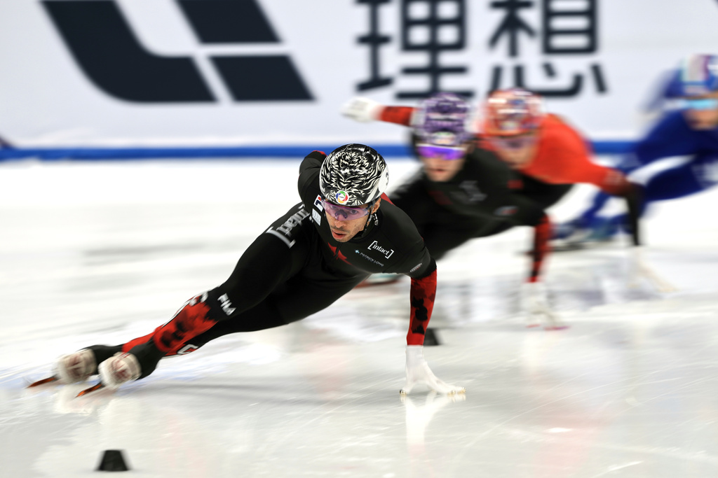 FILE - William Dandjinou of Canada leads in the Men's 1000m Quarterfinals Heat 2 for the ISU World Short Track Championships held at the Capital Indoor Stadium in Beijing, Sunday, March 16, 2025. (AP Photo/Andy Wong, File)